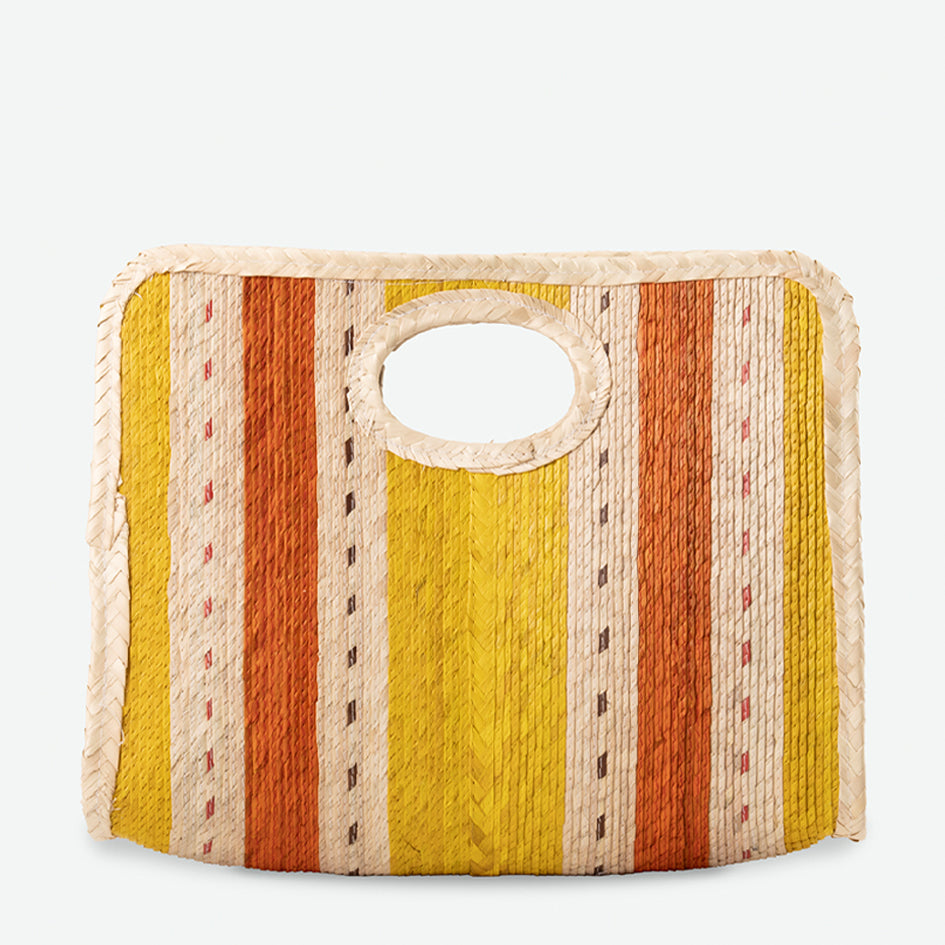 Striped fabric bag with a circular handle on a light gray background