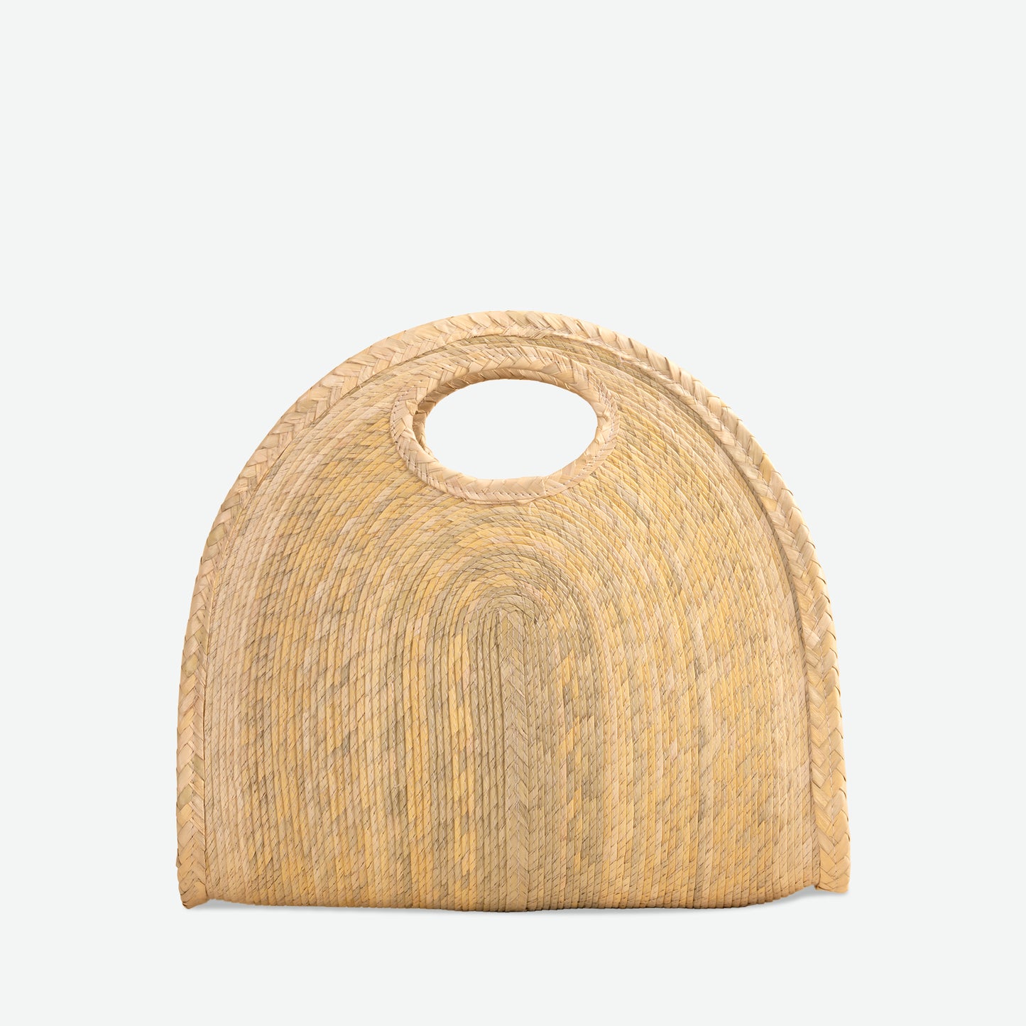 Natural handheld crescent straw tote bag, woven from palm and dyed with organic colors. Summer-ready design by Per Lei New York.