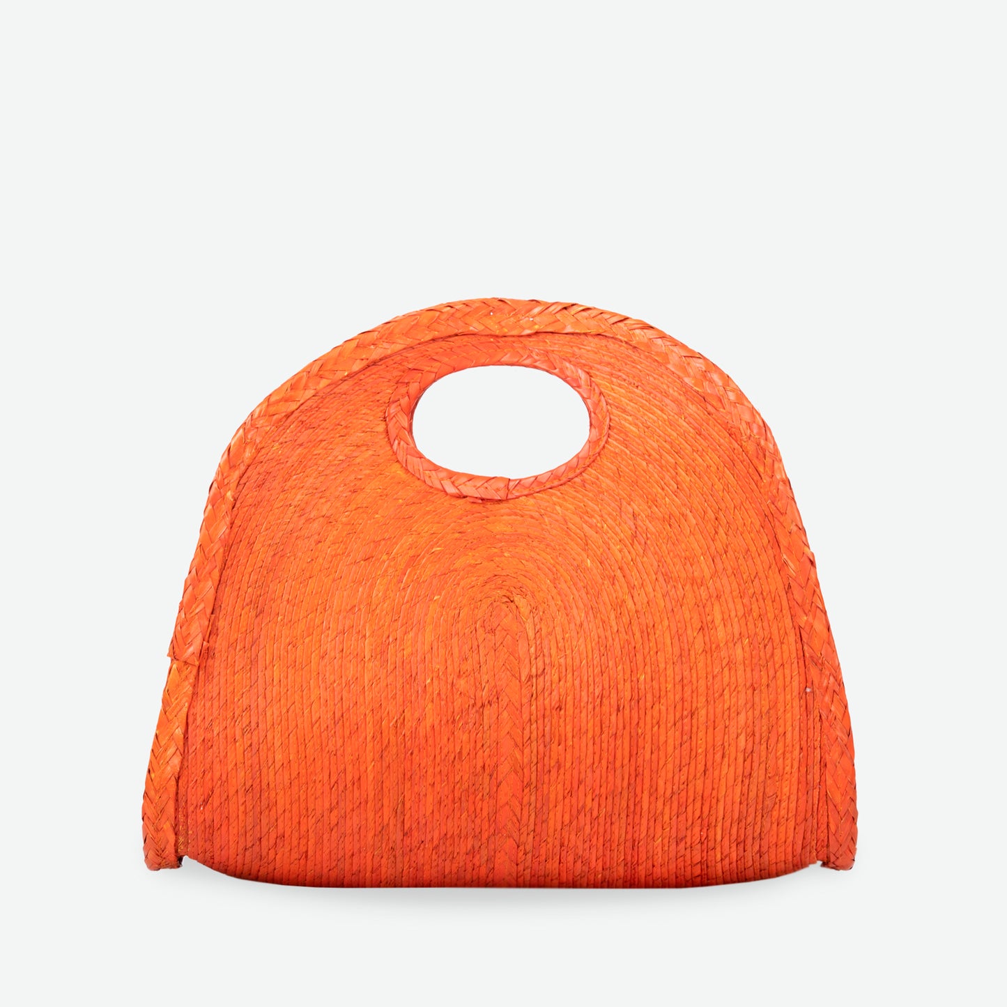Orange handheld crescent straw tote bag, woven from palm and dyed with organic colors. Summer-ready design by Per Lei New York.